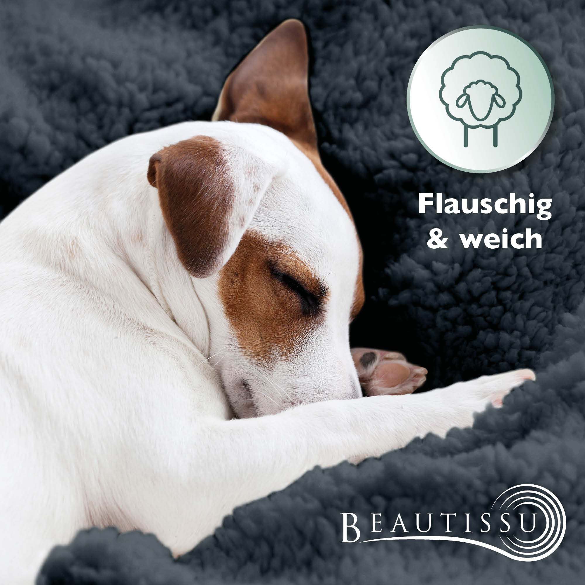 Dog sleeping on a soft, fluffy Beautissu Sherpa Kuscheldecke Alina blanket.