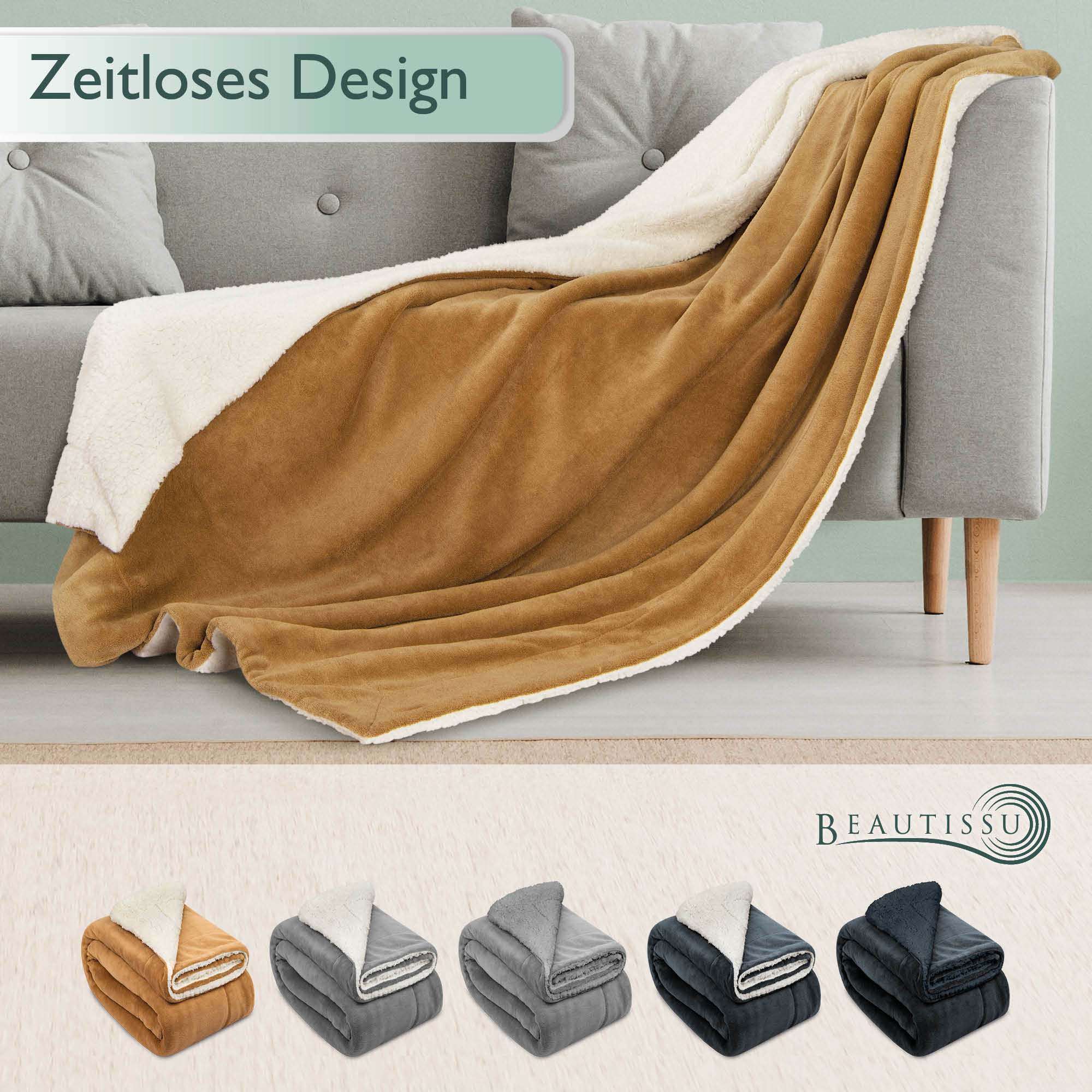 Beautissu Sherpa Kuscheldecke Alina in Beige on Sofa, Available in Sizes 150x200cm and 220x240cm, Various Colors