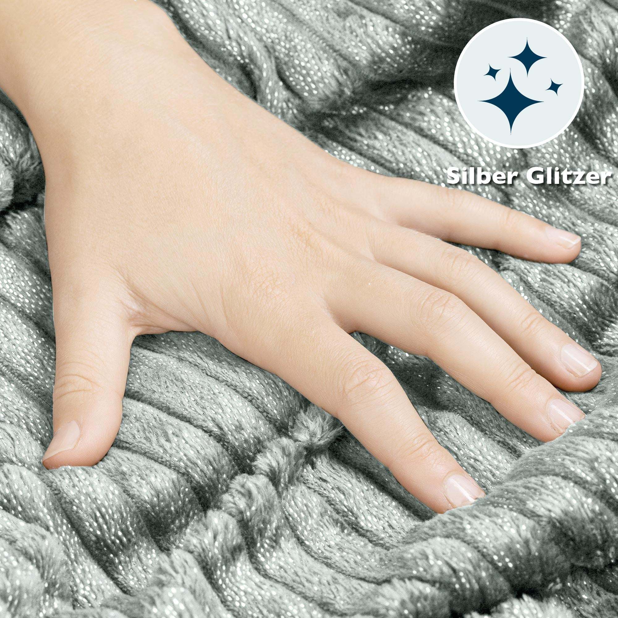 Hand touching Beautissu Sherpa Kuscheldecke Elisa with silver glitter, highlighting the soft and plush texture.
