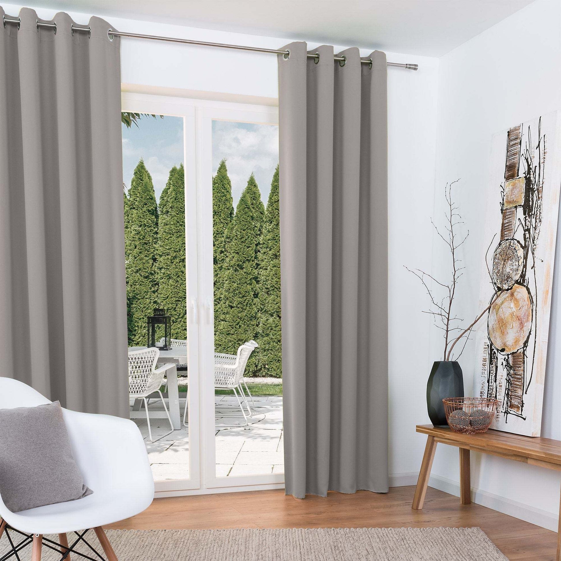 Beautissu Ösenschal Amelie blackout curtains in a modern living room setting.