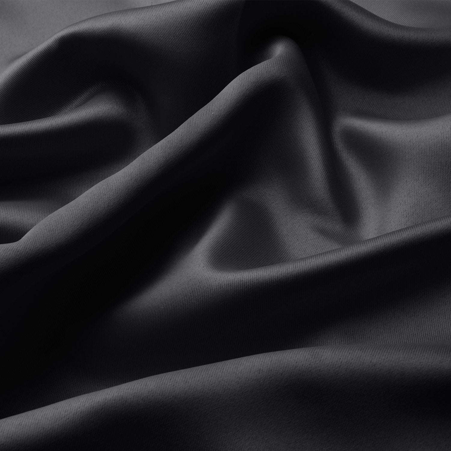 Blackout curtain fabric with elegant folds and glossy finish.