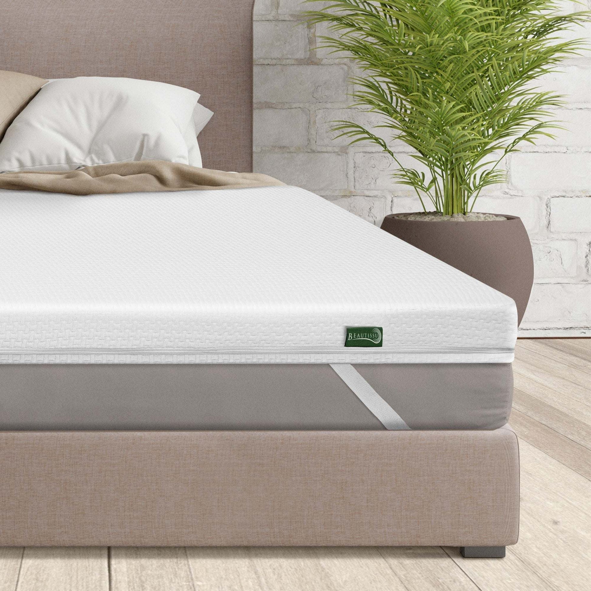 Beautissu BeauNuit MT Lux mattress topper on a bed with 7-zone wave design, enhancing comfort and spinal support.