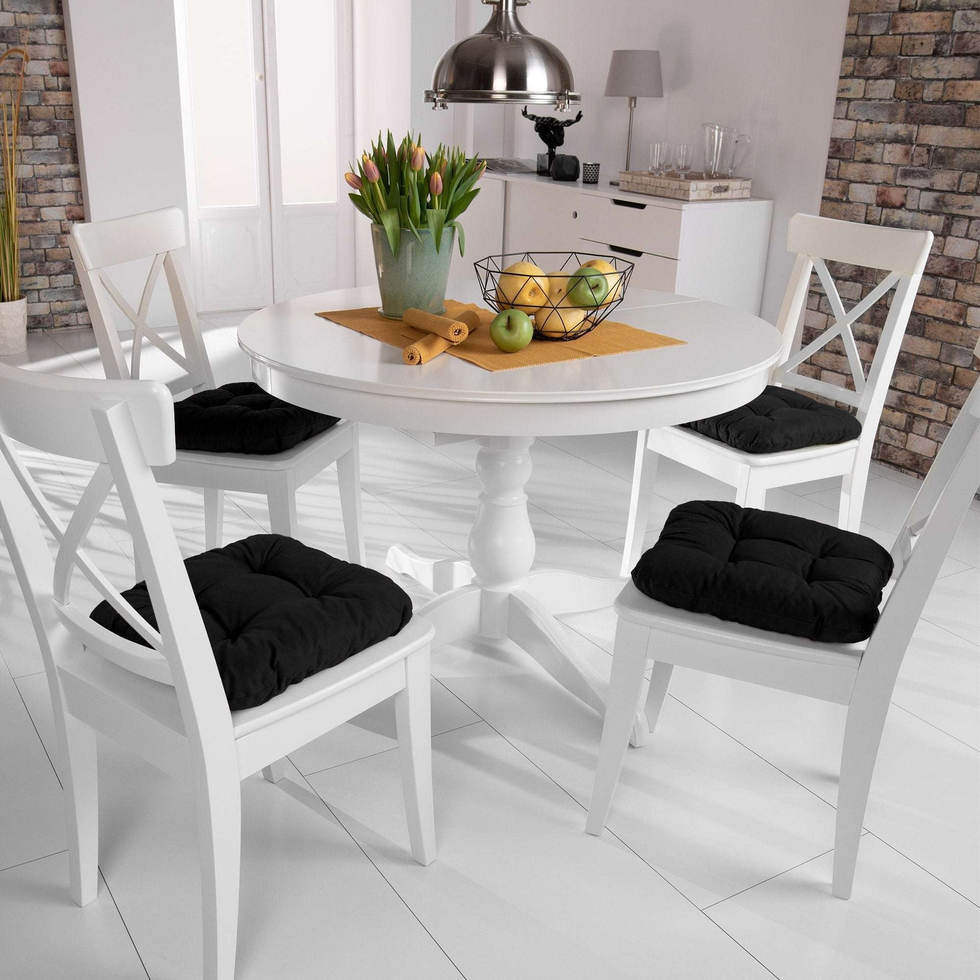 4-piece set of Beautissu Lisa chair cushions in a dining room setting.