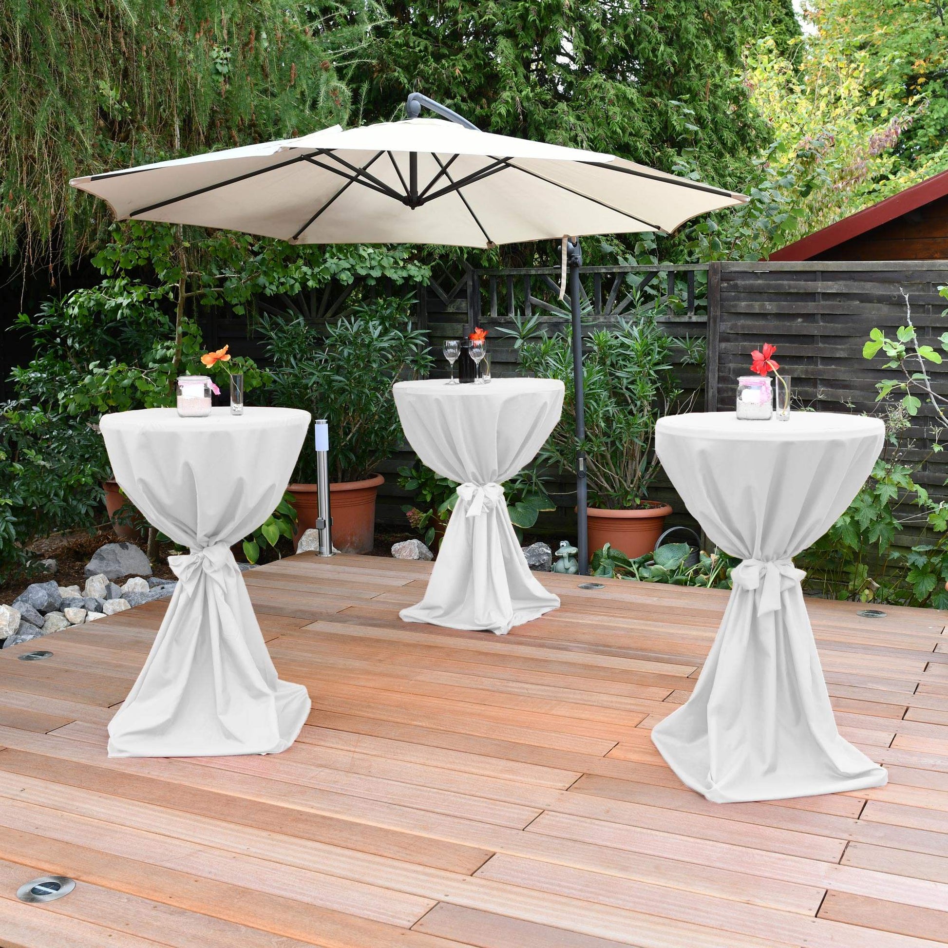 White Beautissu Giulia stretch table cover with bow, elegant design for 60-80cm round tables, suitable for events and weddings.