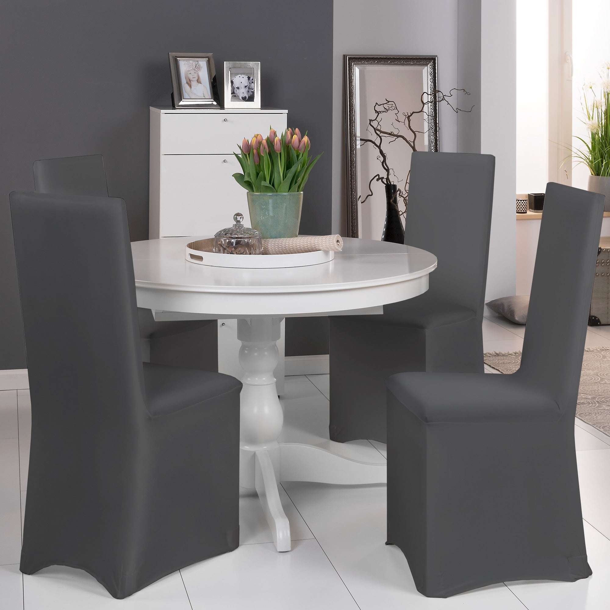 Beautissu Leona Stretch universal banquet chair cover in multiple colors, enhancing a dining room setting.