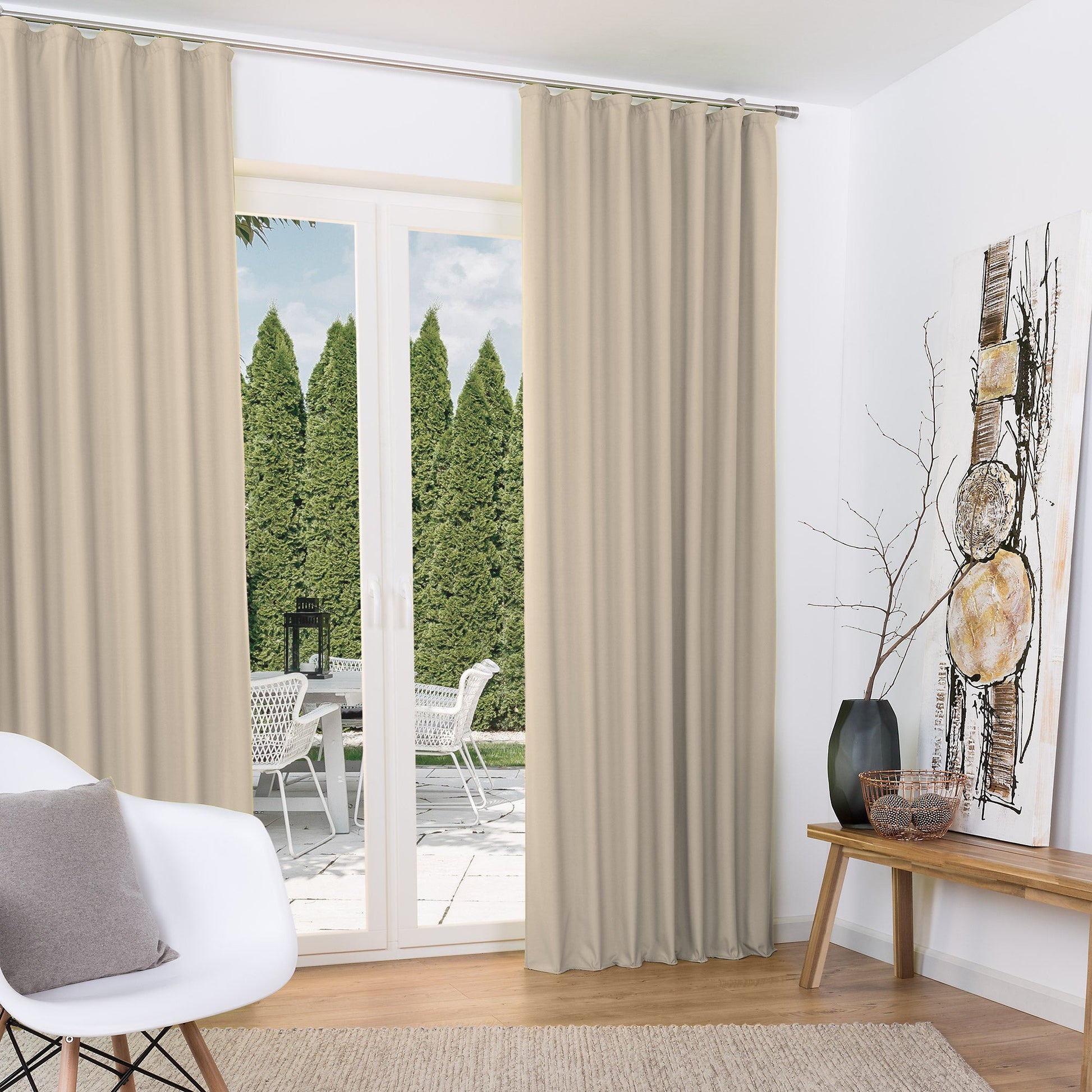 Beautissu Kräuselband Amelie Thermo Vorhänge in beige, elegant draped around a large window, enhancing room decor with high-quality polyester fabric and thermal insulation properties.