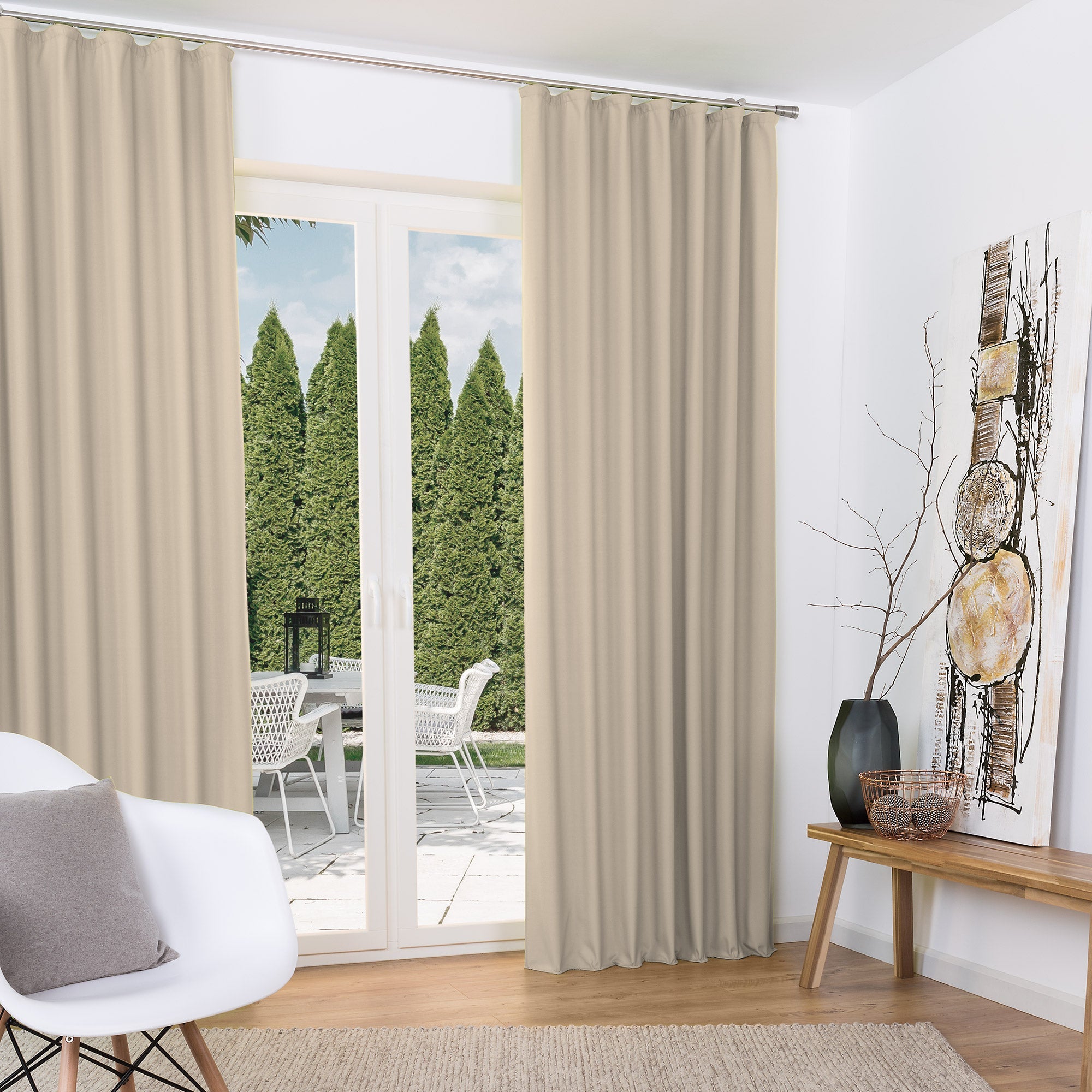 Beautissu Kräuselband Amelie Thermo Vorhänge in beige, elegant draped around a large window, enhancing room decor with high-quality polyester fabric and thermal insulation properties.