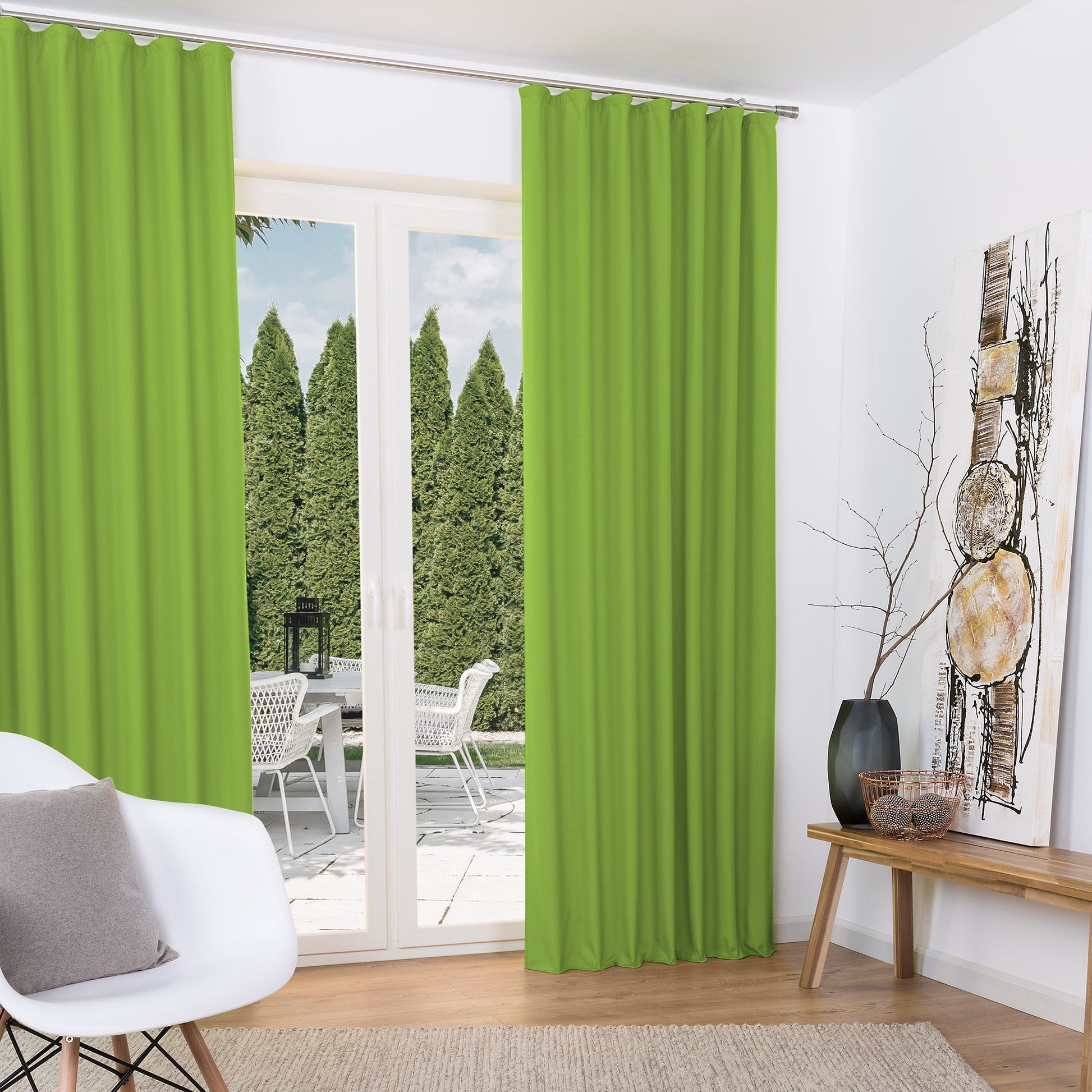 Green thermally insulated curtains with pleat tape from Beautissu's Amelie collection, featuring a sleek design.