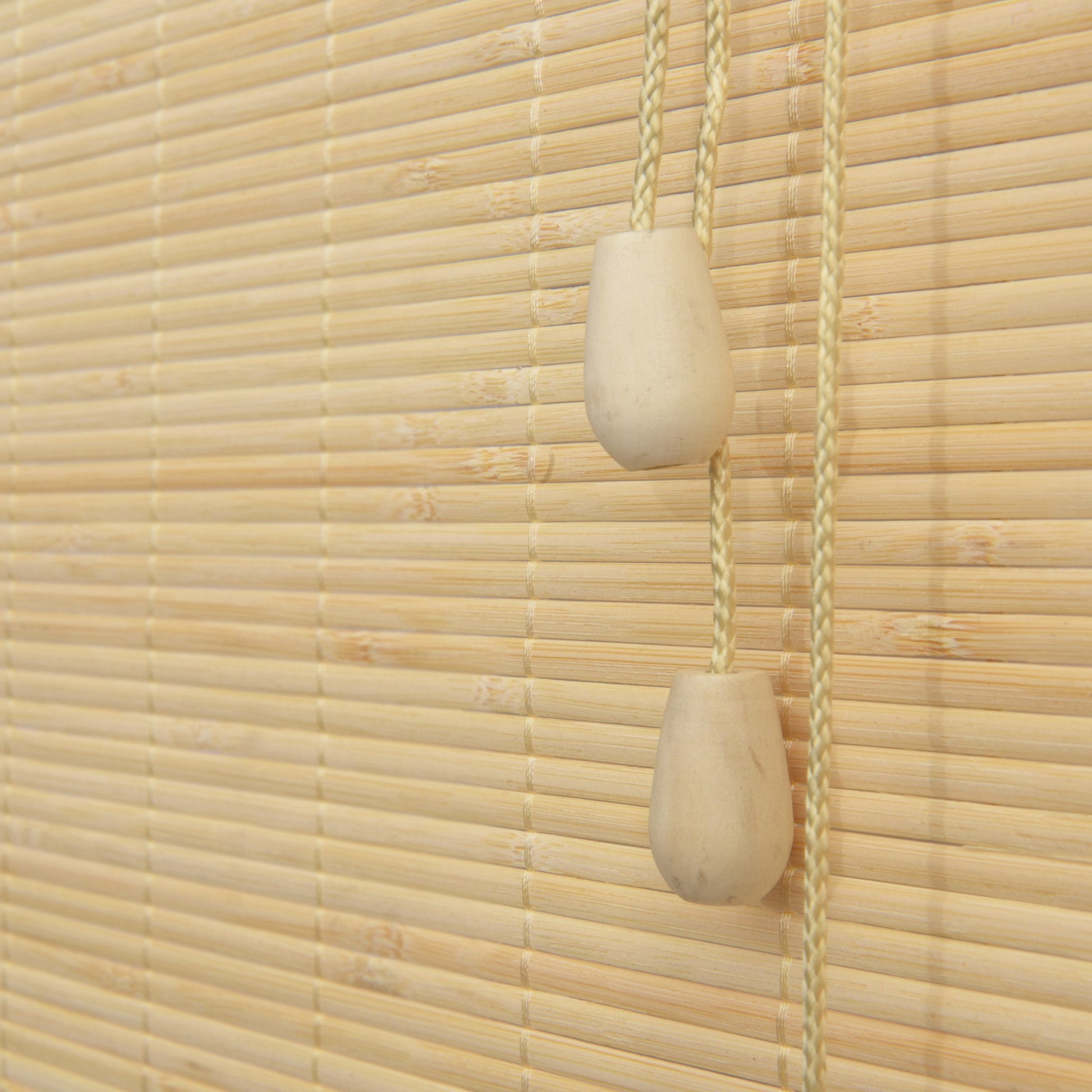 Sol Royal SolDecor B86 bamboo roll-up blind in natural wood finish with cord pull system.